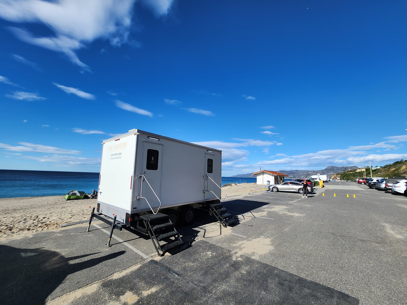 Portable showers delivered to a Utah site with mountain terrain behind the trailer